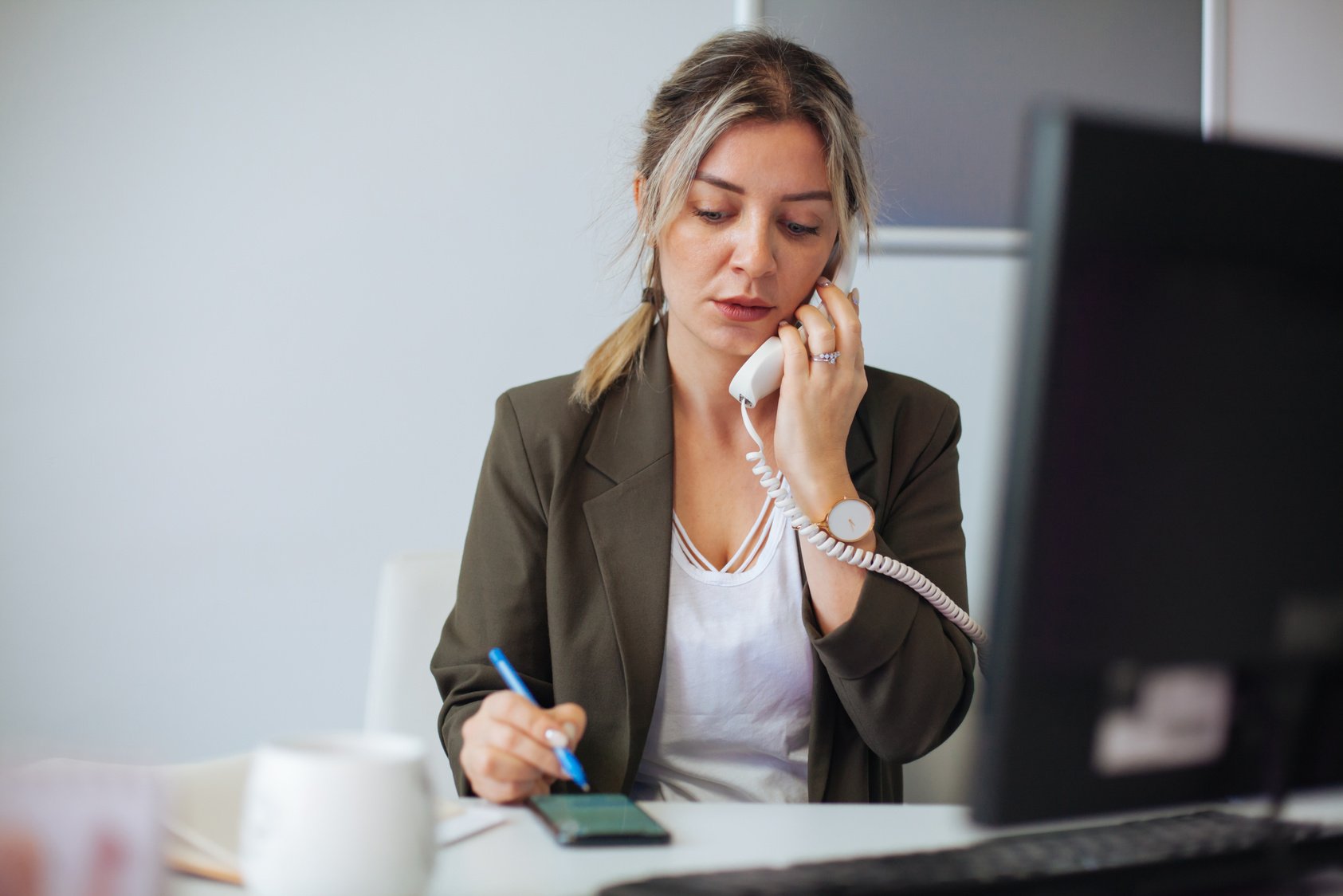 Entrepreneur calling on phone working at office